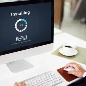 Technician installing Microsoft Windows on a laptop,Professional Windows operating system setup service,PC upgrade with latest Microsoft Windows installation,Expert installing Windows OS for desktop computer,Microsoft Windows installation and configuration service